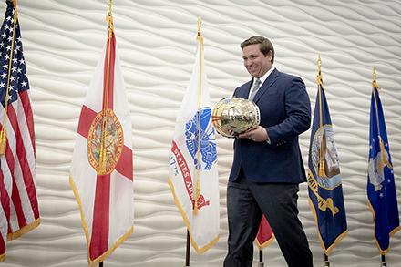 Gov. DeSantis after receiving a military-themed USF Football helmet. 